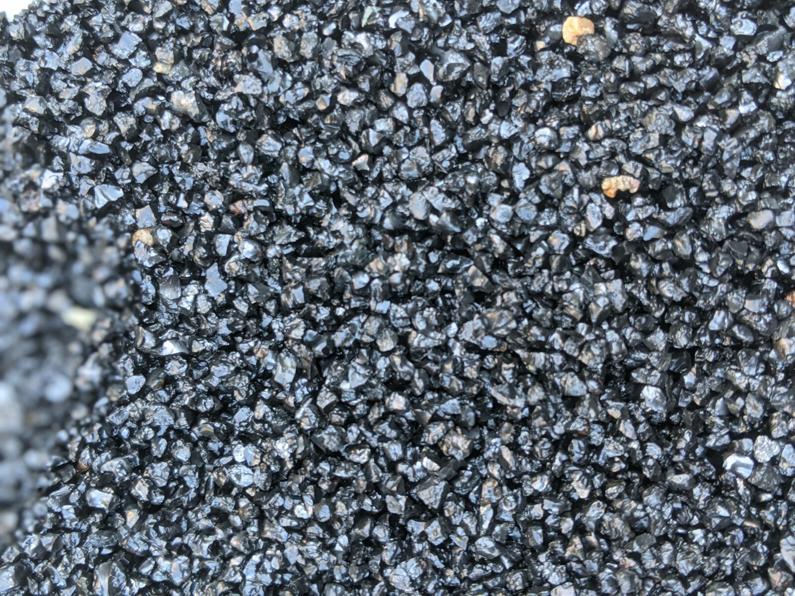 Natural shiny coarse black sand
